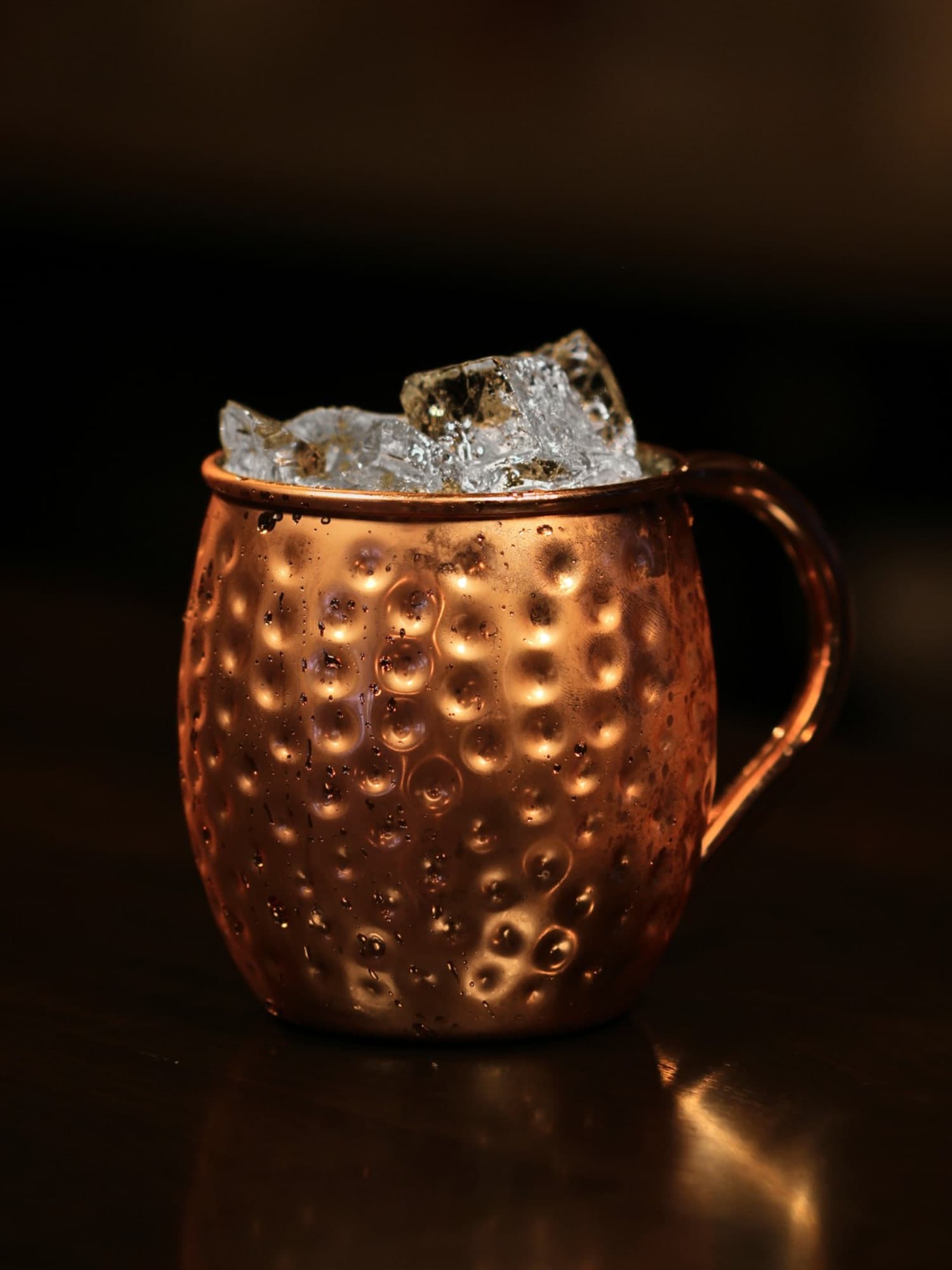 Luckeys New England Vodka, lime and ginger beer over ice in a hammered copper mug on the dark bar